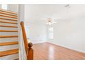 Well-lit staircase leading to a bright and airy upstairs space at 6118 Dorsett St, Douglasville, GA 30134