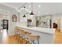 Modern kitchen with white quartz countertops and a spacious island at 6229 Grand Loop Rd, Sugar Hill, GA 30518