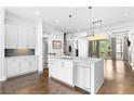 Spacious kitchen with white cabinets, stainless steel appliances, and an island at 818 Highland Green Ne Way # 818, Atlanta, GA 30306