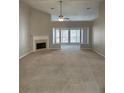 Spacious living room with vaulted ceilings, a fireplace, and abundant natural light at 1685 Keylake Dr, Suwanee, GA 30024