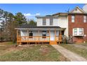 Charming townhouse with painted brick and a cozy front porch, perfect for relaxing outdoors at 8168 Canyon Forge Dr, Riverdale, GA 30274