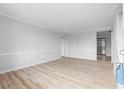 Bright living room with light wood flooring, fresh paint, and modern trim throughout at 8168 Canyon Forge Dr, Riverdale, GA 30274