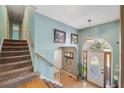 Bright entryway with staircase, hardwood floors and neutral-toned walls at 232 Taylors Farm Dr, Canton, GA 30115