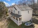 Two-story house with attached two-car garage, side porch, and boat in yard at 232 Taylors Farm Dr, Canton, GA 30115