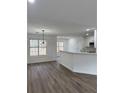 Bright dining area with hardwood floors and a breakfast bar at 235 Prestwyck Oak, Lawrenceville, GA 30043