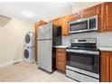 The kitchen includes stainless steel appliances and a stackable washer and dryer at 2355 Henderson Mill Ne Rd # 6, Atlanta, GA 30345