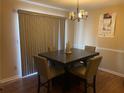 Dining area with a dark wood table and four chairs at 1753 Ridge Se Ct, Conyers, GA 30013