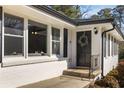 Front entrance with black door and a wreath, showcasing the home's curb appeal at 2488 Elizabeth Ann Ne Ln, Atlanta, GA 30324