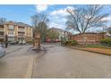 Community entrance with stone pillars and Bentley Place signage for the apartment complex at 533 Bentley Pl, Tucker, GA 30084