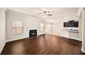 Open living room with a fireplace and hardwood floors at 4860 Longview Run, Decatur, GA 30035