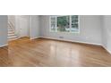 Bright living room featuring hardwood floors and large windows at 785 Mckenzie Sw Ct, Atlanta, GA 30311