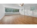 Spacious living area with hardwood floors and an exposed brick wall at 785 Mckenzie Sw Ct, Atlanta, GA 30311