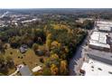 Aerial view of wooded lot near commercial development at 157 New Hope Rd, Fayetteville, GA 30214