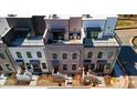 Luxury townhomes with private rooftop decks and modern brick exteriors at 332 Sugarview Rd # 16, Sugar Hill, GA 30518