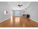 Spacious living room with hardwood floors, fireplace, and vaulted ceiling at 2105 Rock Ct, Loganville, GA 30052