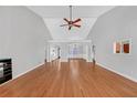 Open living room with hardwood floors and high ceilings at 2105 Rock Ct, Loganville, GA 30052