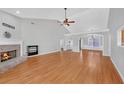 Bright living room featuring hardwood floors and a fireplace at 2105 Rock Ct, Loganville, GA 30052