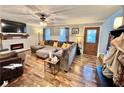 Living room featuring L-shaped sectional and hardwood floors at 414 Deering Dr, Douglasville, GA 30134