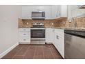 Modern kitchen with stainless steel appliances at 960 N Grand Nw Ave, Atlanta, GA 30318