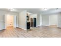 Open concept kitchen with stainless steel appliances and wood cabinets at 2600 Nw Baker Rd, Atlanta, GA 30318