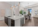 Gourmet kitchen with island seating and wine refrigerator at 40 12Th Ne St # 1004, Atlanta, GA 30309