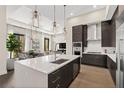 Open concept kitchen featuring a center island and breakfast bar at 40 12Th Ne St # 1004, Atlanta, GA 30309