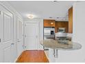 Entryway with hardwood floors and access to kitchen at 3338 Peachtree Ne Rd # 1104, Atlanta, GA 30326