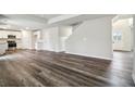 Open concept kitchen with stainless steel appliances and vinyl plank flooring at 576 Rodeo Dr, Auburn, GA 30011