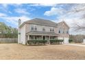 Two-story house with a large front yard and driveway at 601 Rangeley Meadows Ct, Hampton, GA 30228