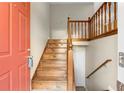 Wooden staircase leading to the upper level of the home at 3335 Pinta Way, Douglasville, GA 30135