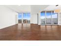 Bright living room featuring hardwood floors and large windows at 1820 Peachtree Nw St # 1909, Atlanta, GA 30309