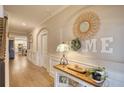 Bright and spacious entryway with hardwood floors and stylish decor at 340 New Alcovy Rd, Social Circle, GA 30025