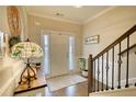 Front entry with hardwood floors, coat rack, and view of staircase at 340 New Alcovy Rd, Social Circle, GA 30025