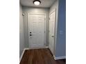 Front entry with coat closet and wood-look flooring at 268 Springbottom Dr, Lawrenceville, GA 30046