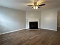 Living room with fireplace and wood-look floors at 268 Springbottom Dr, Lawrenceville, GA 30046