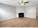 Spacious living room featuring a fireplace and light wood flooring at 268 Springbottom Dr, Lawrenceville, GA 30046