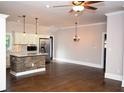 Modern kitchen with stainless steel appliances, a large island, and hardwood floors at 3002 Laguna Dr, Decatur, GA 30032