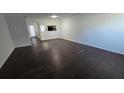 Spacious living room featuring dark brown wood-look flooring at 6628 Wellington Sq, Norcross, GA 30093