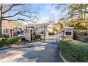 Landscaped entryway with gated access to the community at 1150 Collier Nw Rd # J15, Atlanta, GA 30318