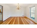 Formal dining room with hardwood floors and chandelier at 157 Timberlost Trl, Suwanee, GA 30024