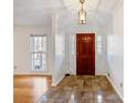 Bright entryway with tile floors and wood door at 157 Timberlost Trl, Suwanee, GA 30024