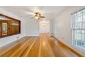 Spacious living area with hardwood floors and built-in shelving at 157 Timberlost Trl, Suwanee, GA 30024