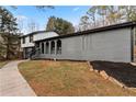 Gray house exterior with walkway and landscaping at 4399 Plantation Ln, Norcross, GA 30093