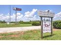 Fox Winery sign with vineyard in background, open Wed-Sat 10am-6pm, Sun 1pm-6pm at 1257 Pj East Rd, Covington, GA 30014