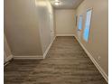 Spacious bonus room with vinyl flooring and door at 4221 Sw Notting Hill Sw Dr, Atlanta, GA 30331