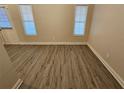 Simple dining room with vinyl flooring and window at 4221 Sw Notting Hill Sw Dr, Atlanta, GA 30331