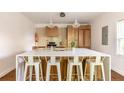 Modern kitchen with white countertops, wooden cabinets, and a large island at 673 Windsor Sw St, Atlanta, GA 30310