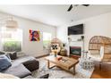 Spacious living room with hardwood floors, sectional sofa, fireplace and large TV at 673 Windsor Sw St, Atlanta, GA 30310