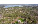 Aerial view of a home on a large lot near a lake at 3505 Moss Landing Rd, Acworth, GA 30102