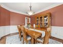 Formal dining room with hardwood floors, and a wooden dining set at 2035 Walnut Creek Xing, Alpharetta, GA 30005